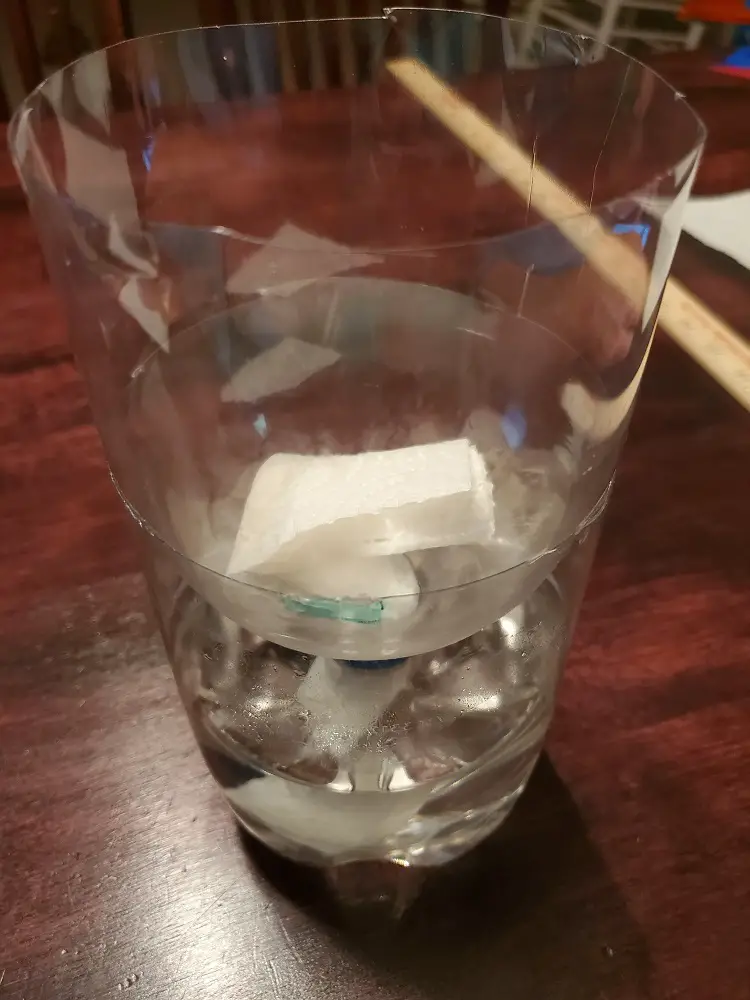 Paper towel in bottle with water.