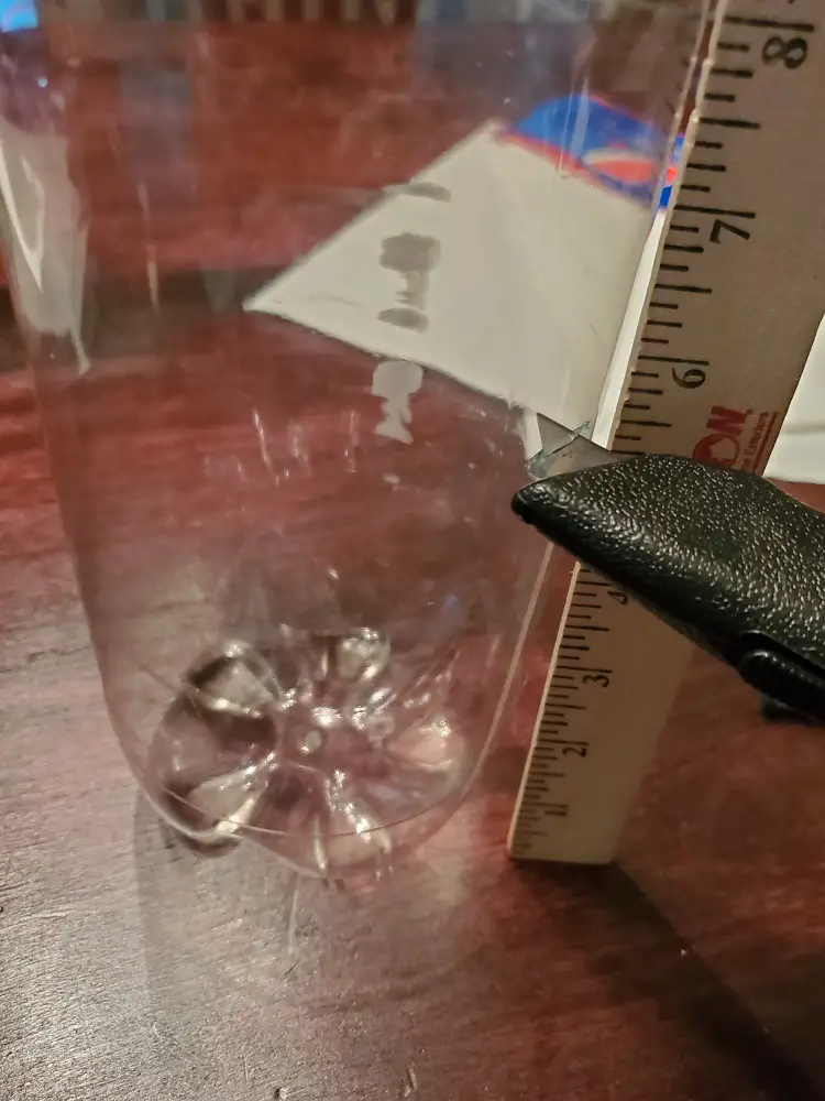 Cutting bottle with boxcutter.