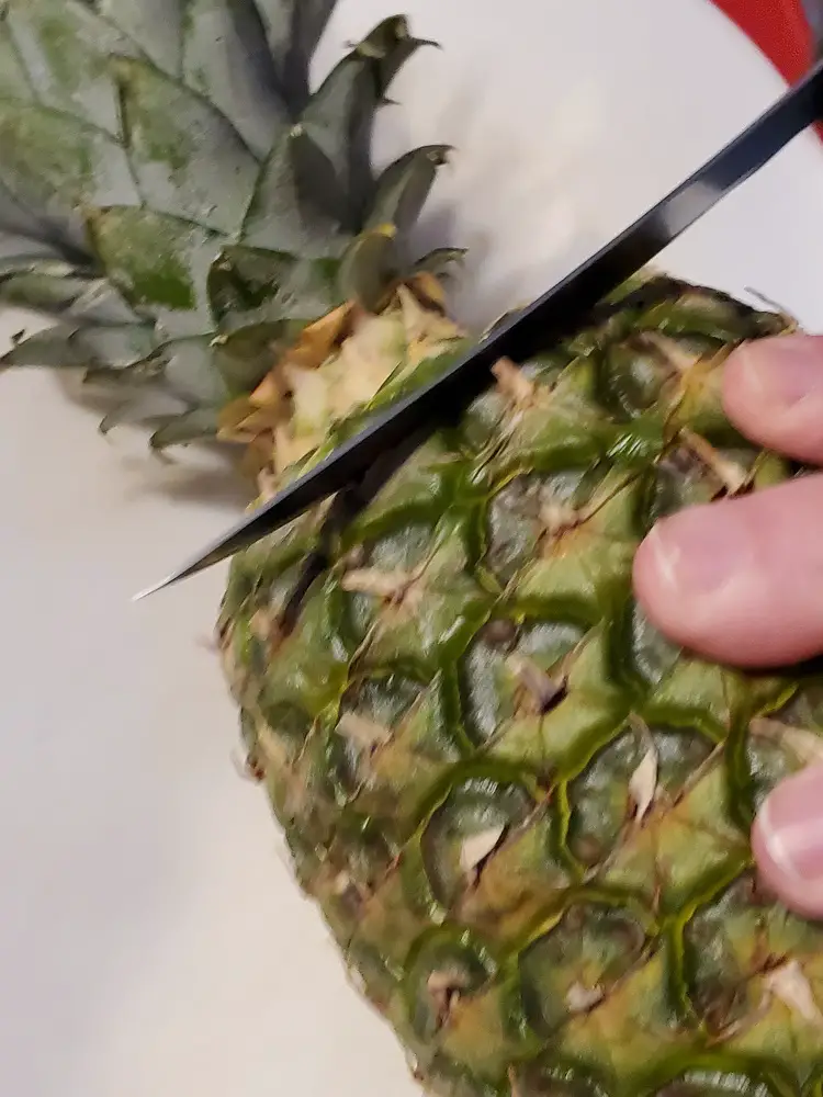 Cutting the crown of the Pineapple